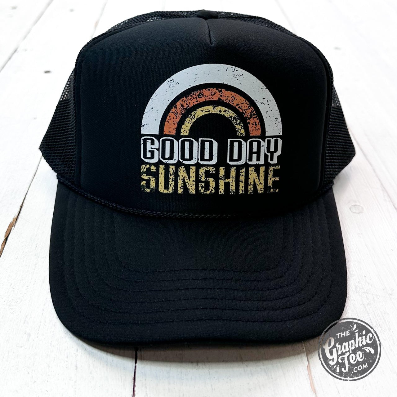 Good Day Sunshine foam trucker cap by The Graphic Tee, featuring a colorful sun graphic and breathable mesh back.