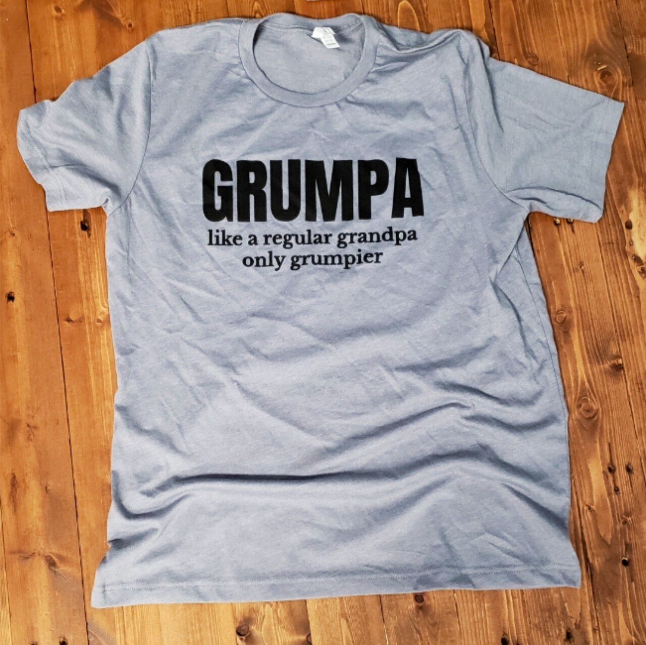 Heather storm graphic tee featuring a grumpy grandpa design on a short-sleeve cotton shirt by The Graphic Tee.