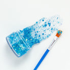 Blue hair glitter headband by Gussy Up Bow Co. featuring sparkly blue glitter embellishment on a soft headband.