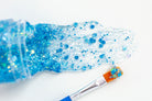 Blue hair glitter headband by Gussy Up Bow Co., featuring sparkling glitter design with a comfortable headband fit.