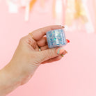Blue hair glitter headband by Gussy Up Bow Co. featuring sparkling blue glitter accents and a comfortable elastic band.