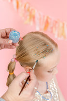 Blue hair glitter headband by Gussy Up Bow Co. featuring shimmering, sparkly design for festive or stylish wear.