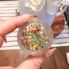 Colorful headband with glitter design from Gussy Up Bow Co.'s End of the Rainbow Hair Glitter collection.