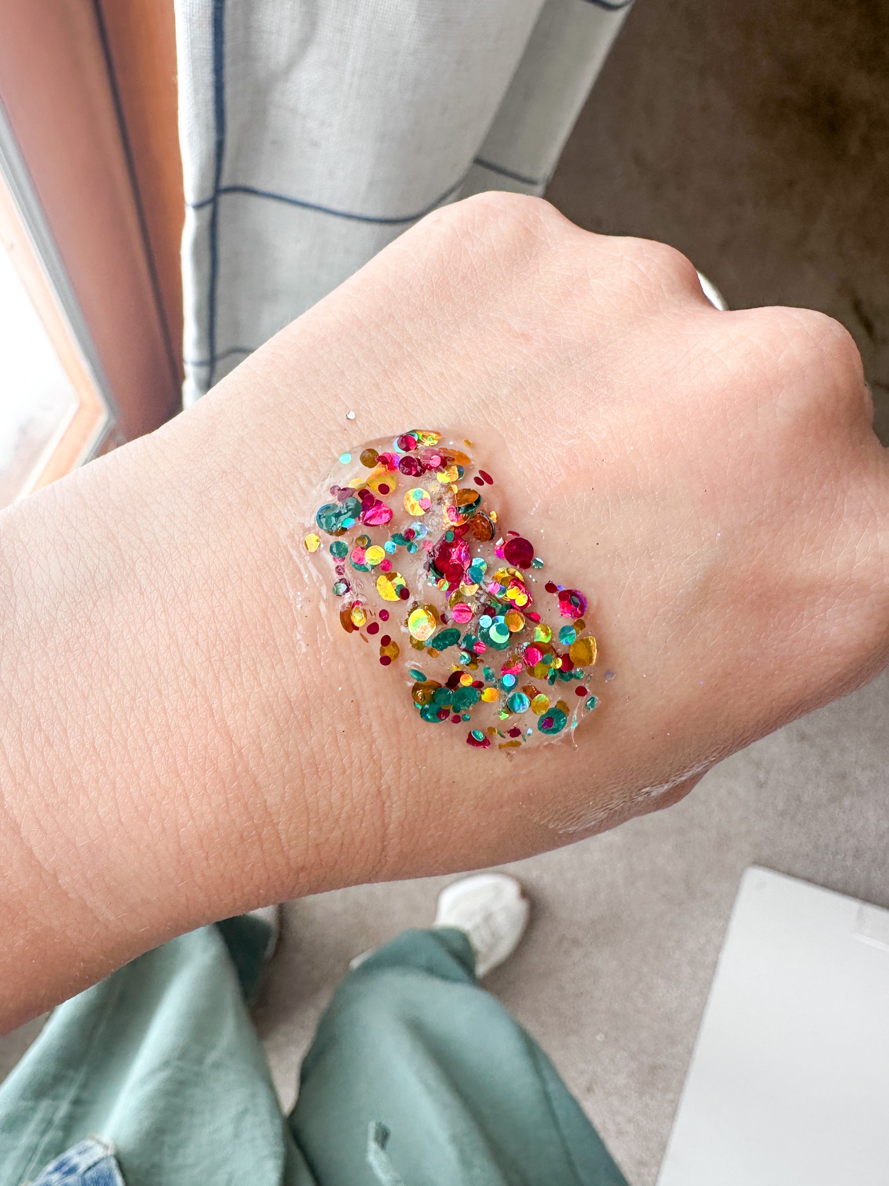 Gussy Up Bow Co. Jewel Hair Glitter headband with sparkling rhinestones and colorful glitter accents on a soft fabric band.