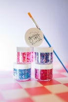 Multicolor hair glitter headband by Gussy Up Bow Co. featuring vibrant glitter accents and a comfortable elastic band.