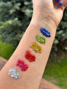 Rainbow Hair Glitter Stack headbands from Gussy Up Bow Co. featuring colorful glitter accents on a stylish headband.