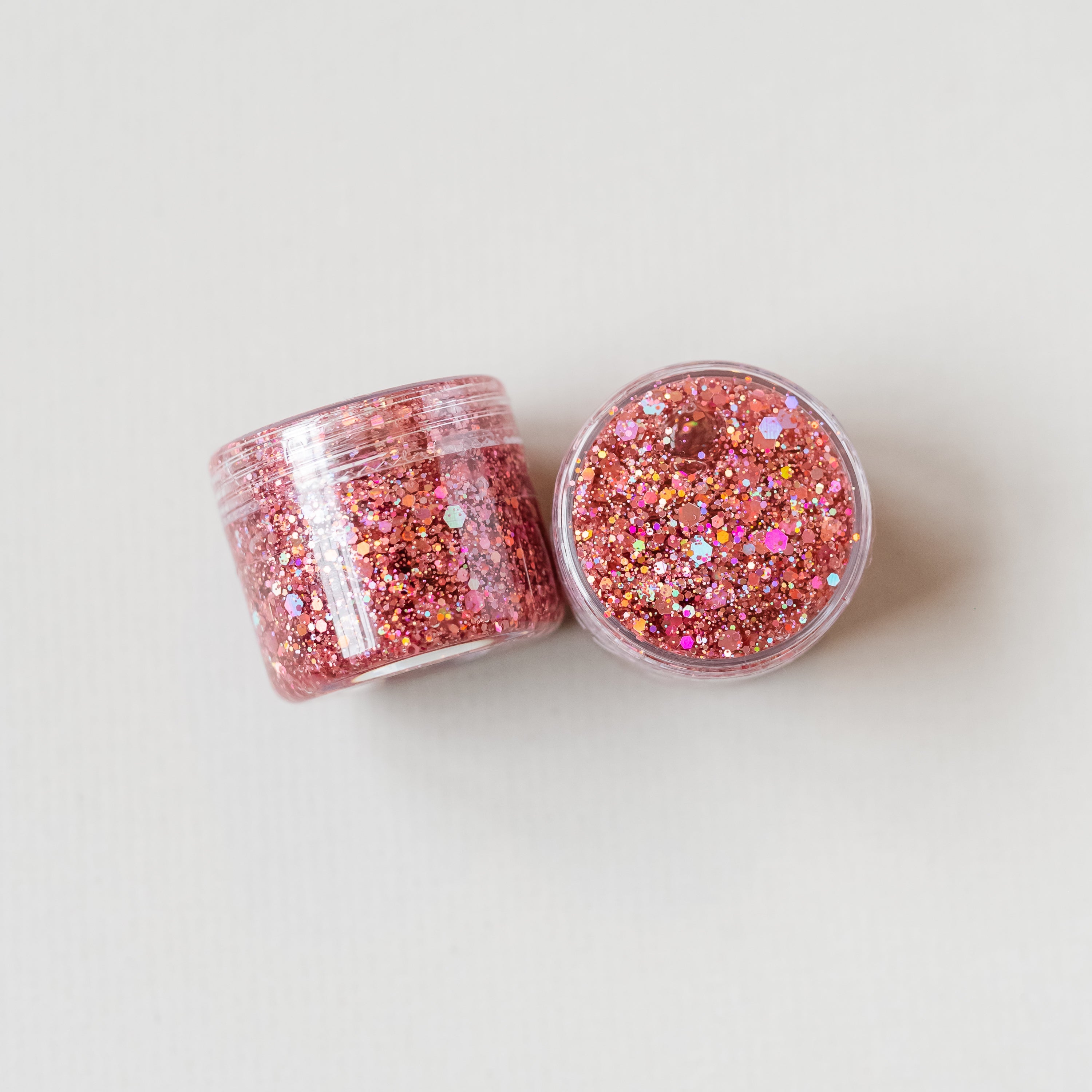 Rose gold hair glitter headband by Gussy Up Bow Co., featuring sparkling glitter and a comfortable headband design.