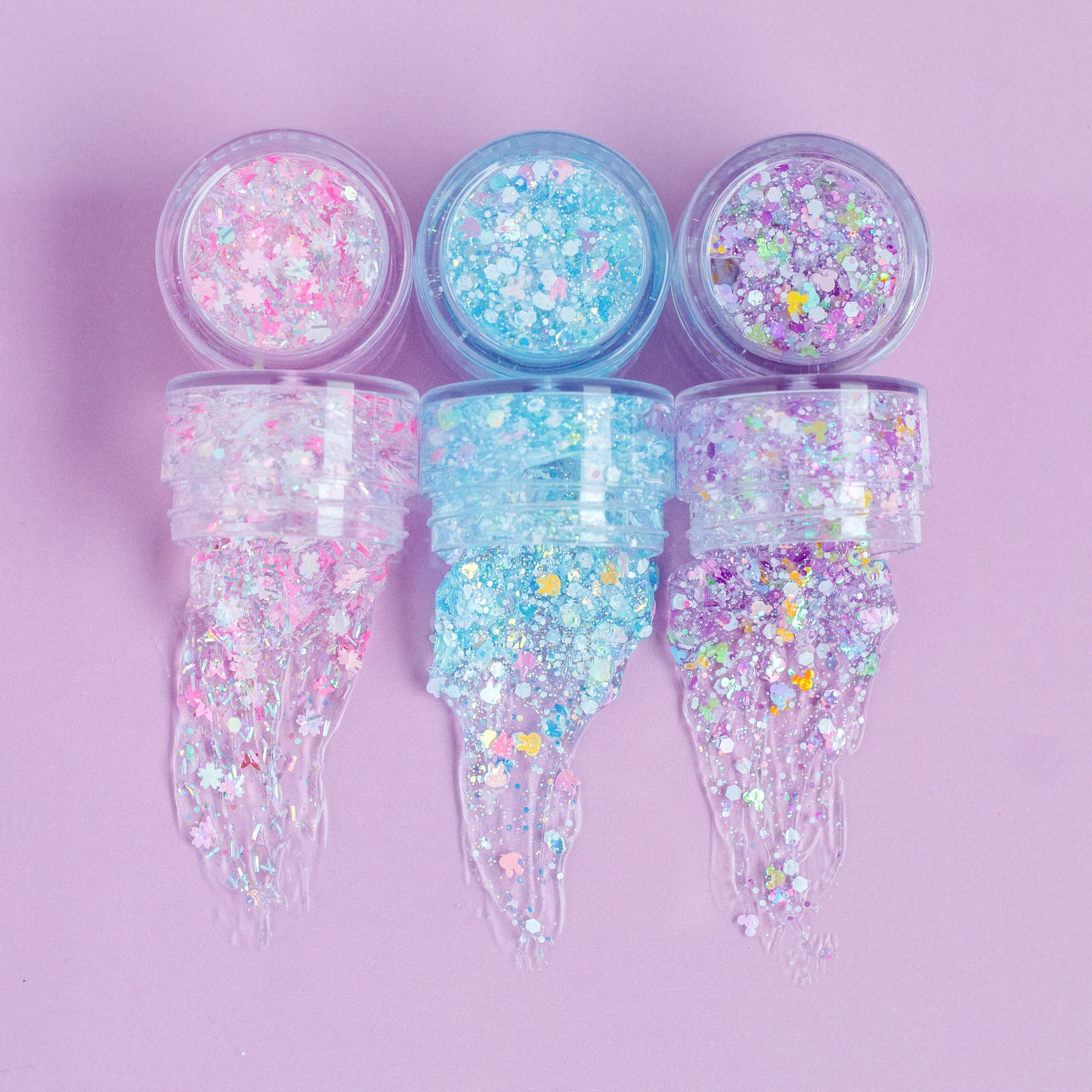 Gussy Up Bow Co. Secret Garden hair glitter headband with colorful glitter accents on a fabric band for festive hair styling.