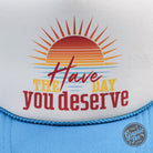 Neon blue and white foam trucker cap with "Have the Day You Deserve" text by The Graphic Tee, adjustable snapback style