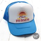 Neon blue and white foam trucker cap with "Have the Day You Deserve" slogan from The Graphic Tee, adjustable mesh back and curved brim.