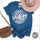 Have The Day You Deserve short sleeve graphic tee by The Graphic Tee, featuring bold text on a casual cotton t-shirt.
