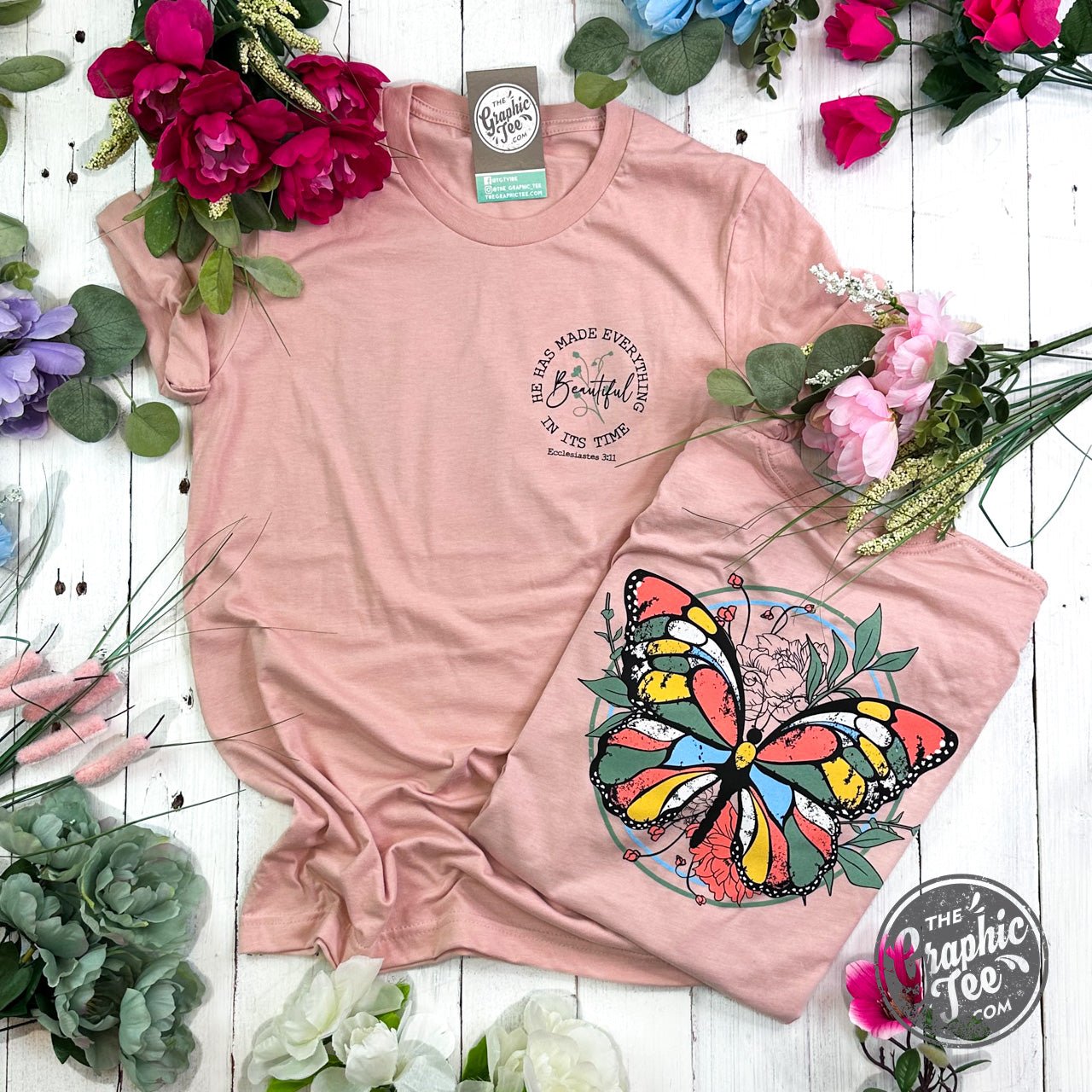 Short sleeve graphic tee by The Graphic Tee with the quote "He Has Made Everything Beautiful In Its Time" printed on front.