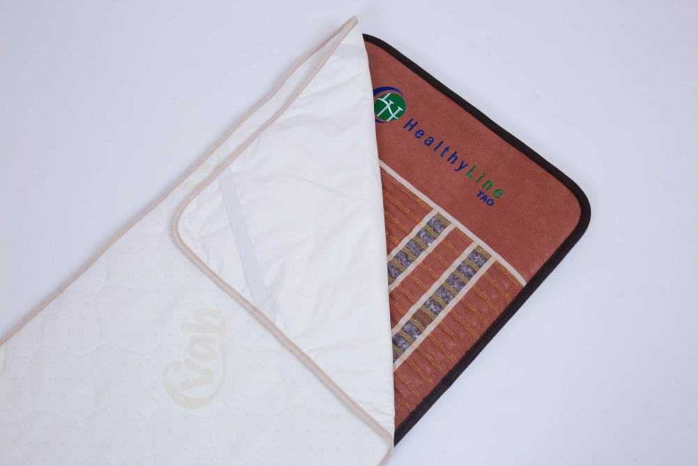 HealthyLine waterproof cover with cotton padding, designed for protection and comfort on medical or spa mattresses.