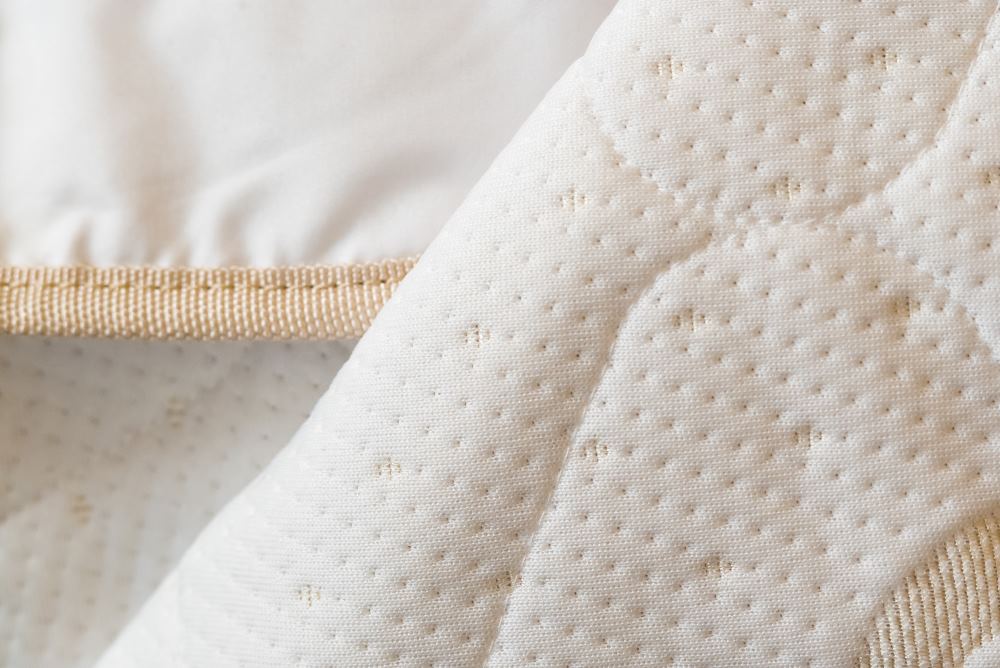 HealthyLine waterproof cotton padded cover for protection and comfort, designed for massage tables or beds.