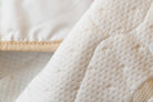 HealthyLine waterproof cotton padded cover for protection and comfort, designed for massage tables or beds.