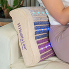 Rainbow Chakra Series pillow by HealthyLine featuring vibrant, multicolored design and ergonomic shape for chakra alignment and relaxation.