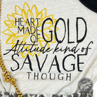 Gold heart graphic on The Graphic Tee's attitude-inspired SS graphic tee, showcasing bold, stylish design for casual wear.