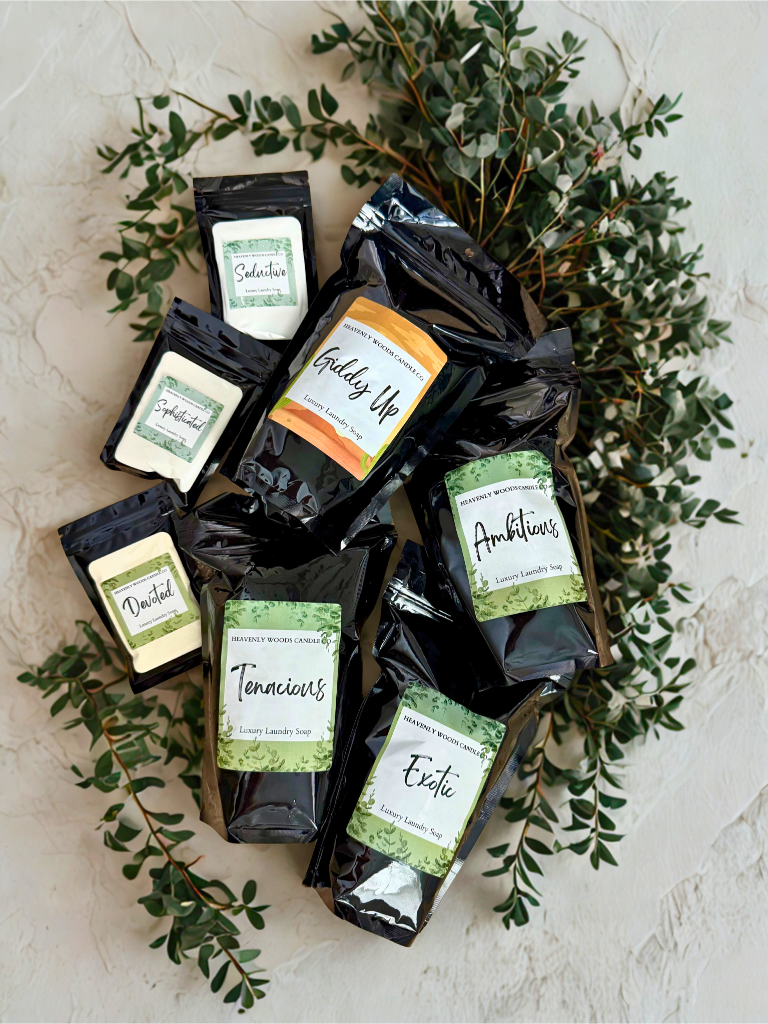 Heavenly Woods Candle Co HWCC Luxury Laundry Soap sample in a 2oz bottle with elegant packaging and sophisticated branding.