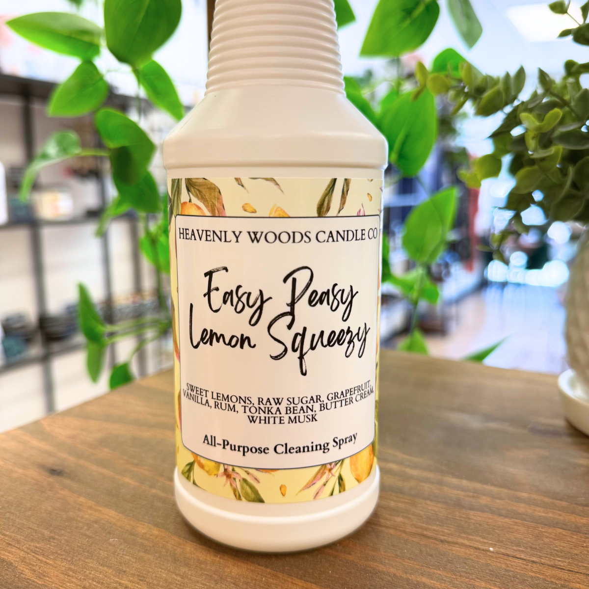 Heavenly Woods Candle Co Easy Peasy Lemon all-purpose cleaning spray bottle with lemon scent and spray nozzle.