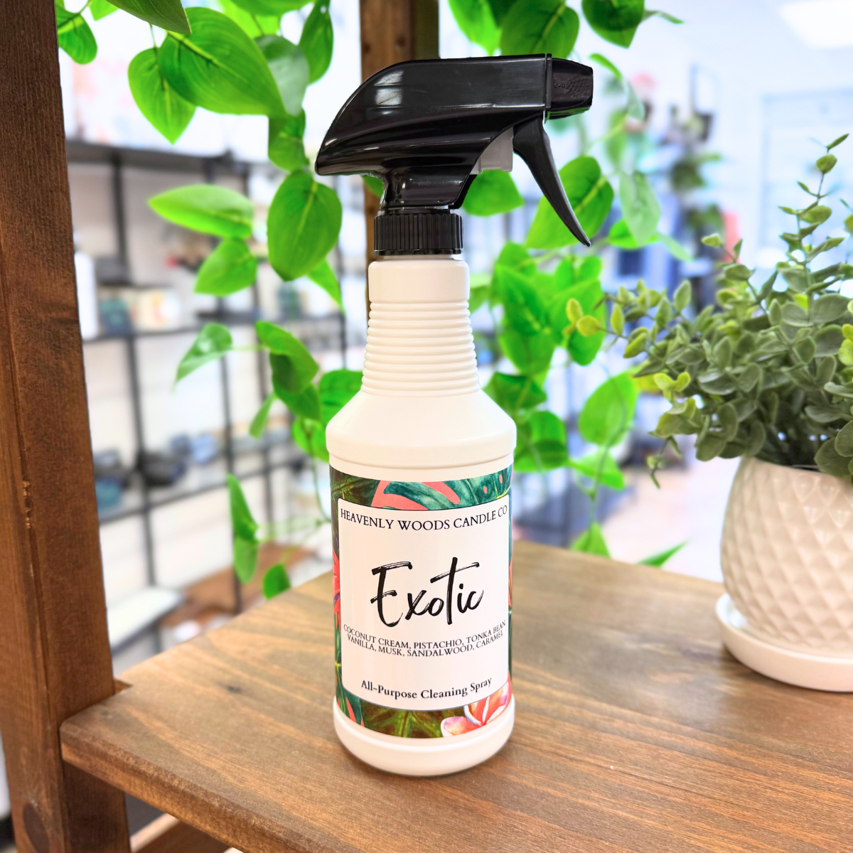 Exotic All-Purpose Cleaning Spray by Heavenly Woods Candle Co, clear spray bottle with label, suitable for cleaning and freshening surfaces