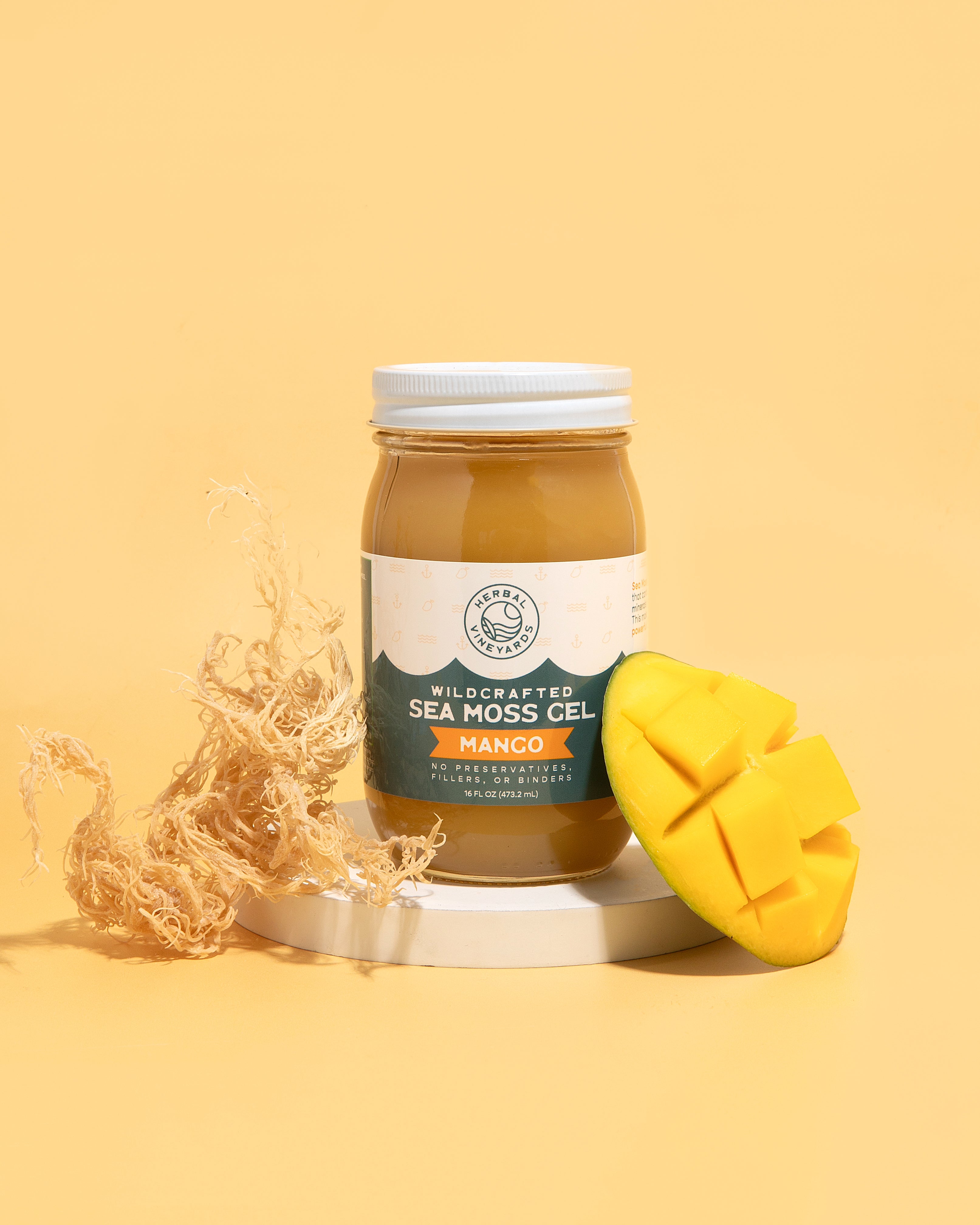 Herbal Vineyards Mango Sea Moss Gel in a clear jar with a smooth, vibrant orange gel visible inside.