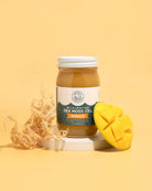 Herbal Vineyards Mango Sea Moss Gel in a clear jar with a smooth, vibrant orange gel visible inside.