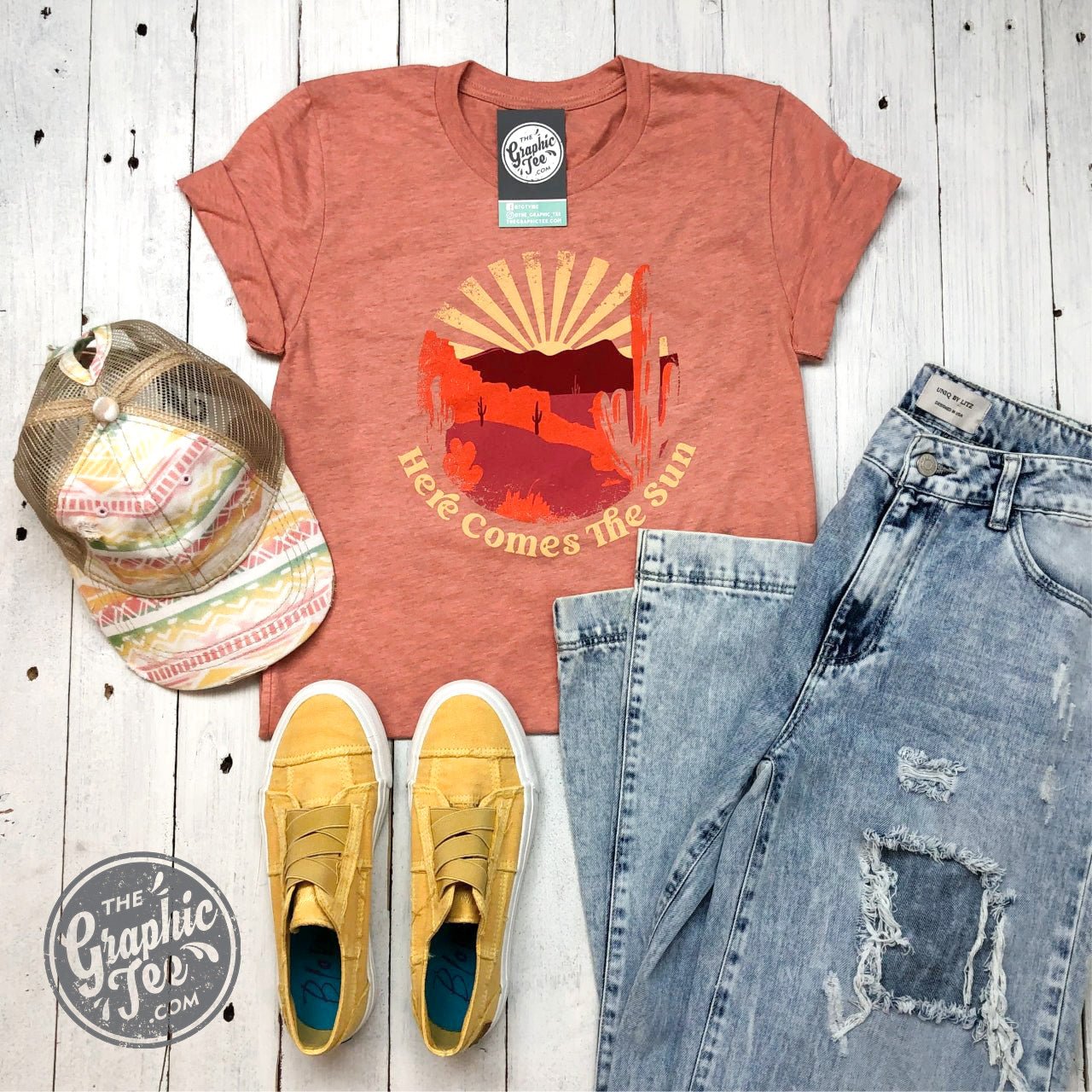 Here Comes The Sun graphic short sleeve tee by The Graphic Tee featuring a cheerful sun design on soft fabric.