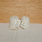 Honeybee Hippie rest bath soak in a cotton bag, natural bath salt for relaxing and soothing bath experiences.