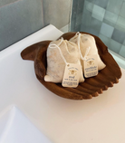 Honeybee Hippie rest bath soak in a cotton bag, calming bath salt for relaxing and soothing bath experiences.