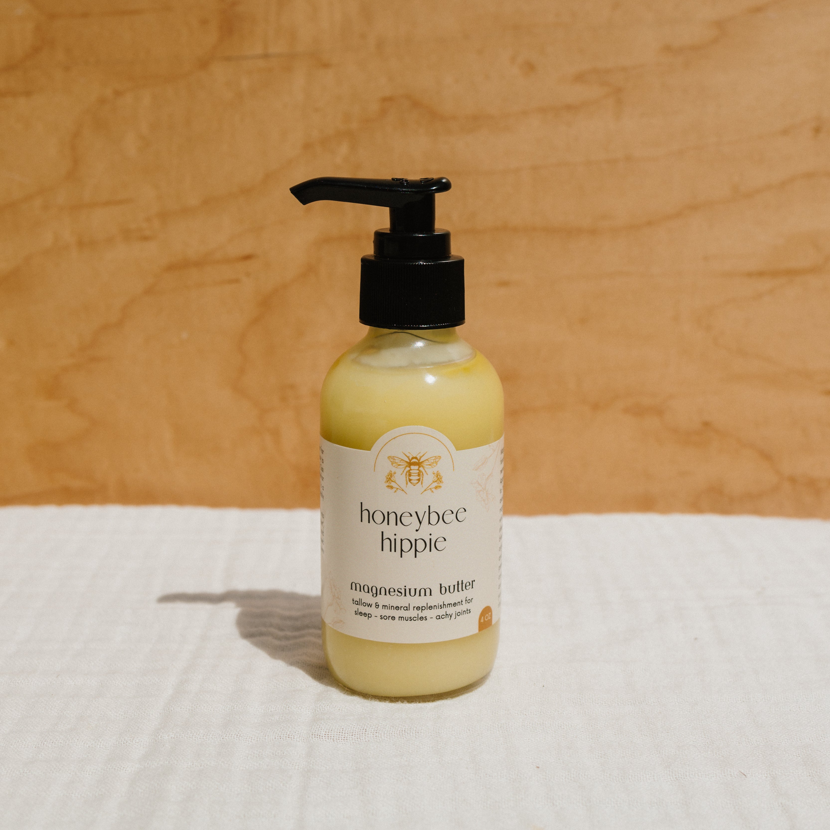 Creamy magnesium butter by Honeybee Hippie in a jar, showcasing the smooth, natural texture of the magnesium-infused skincare product.