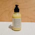 Creamy Honeybee Hippie Magnesium Butter jar showing the natural, smooth magnesium butter texture in a clear container.