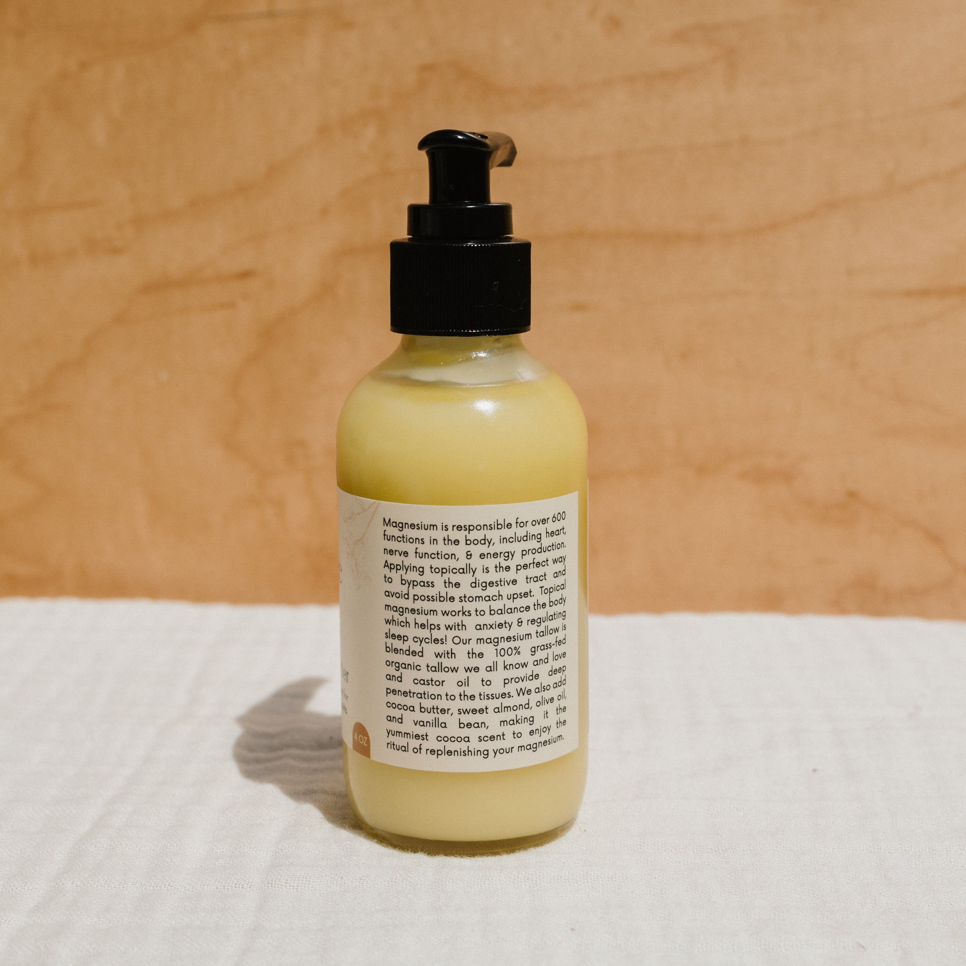 Creamy Honeybee Hippie Magnesium Butter jar showing the natural, smooth magnesium butter texture in a clear container.