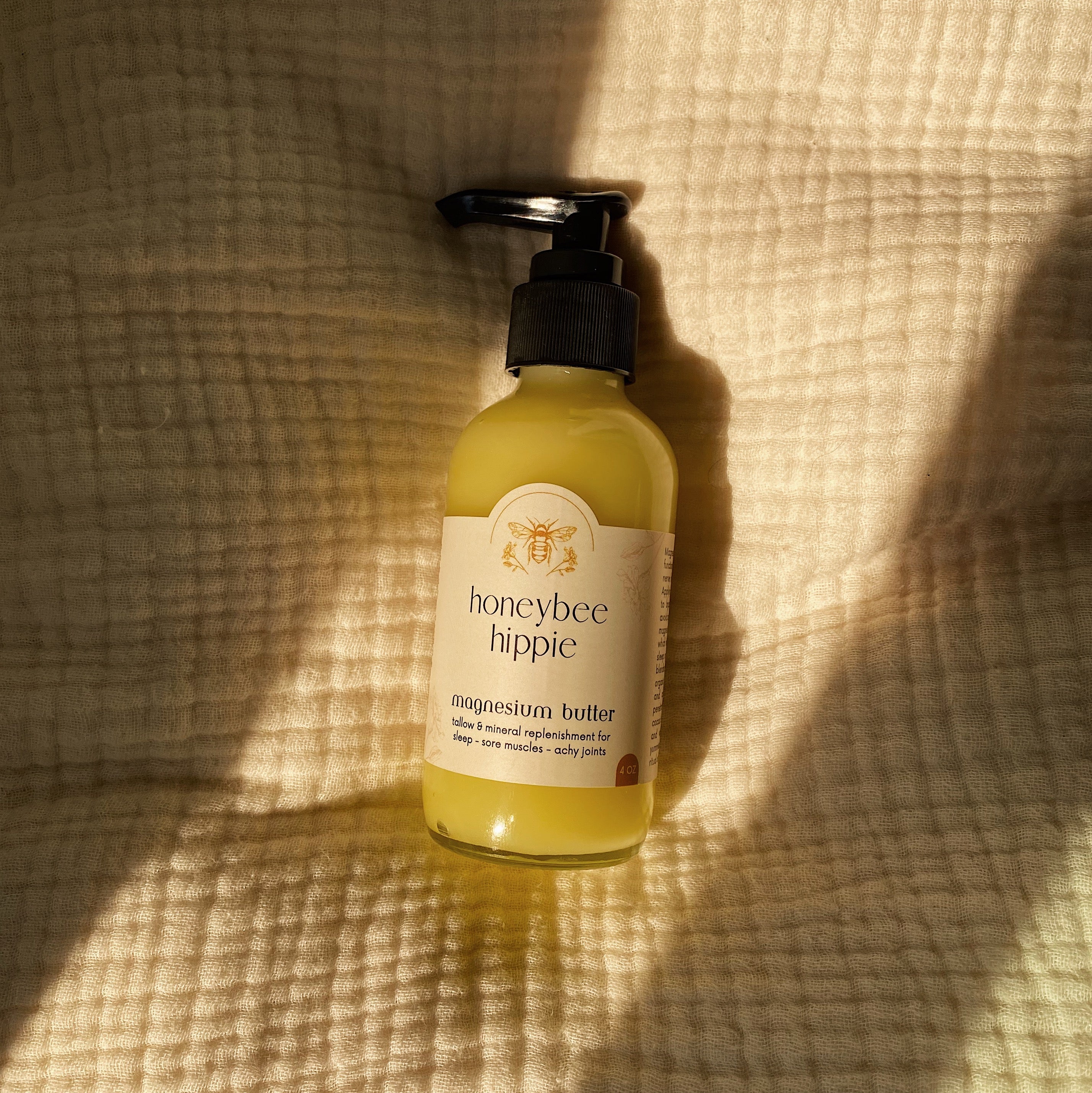 Honeybee Hippie Magnesium Butter jar with natural ingredients, smooth texture, and label visible on the container.