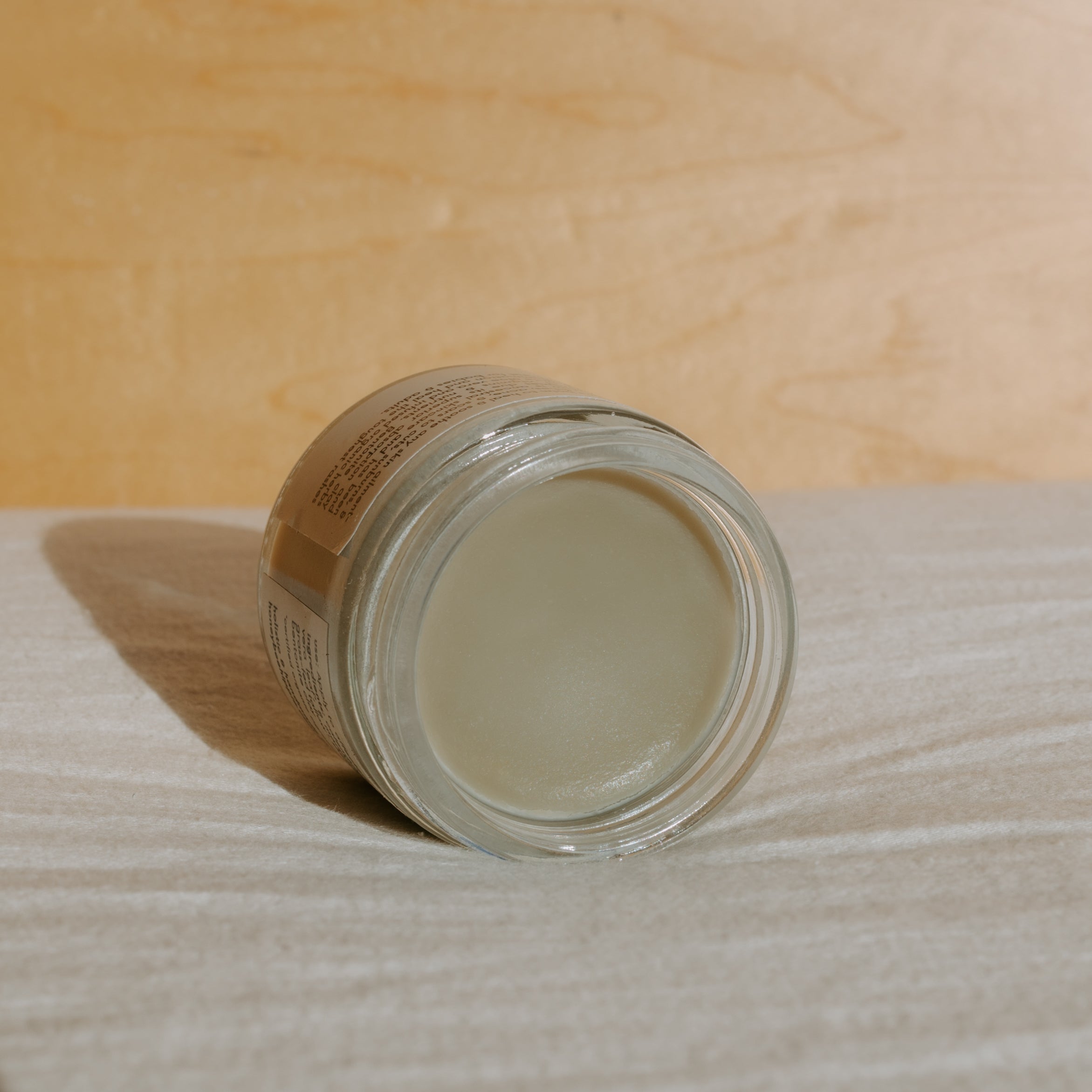 Honeybee Hippie Miracle Mud jar with label, showcasing natural skincare product for detoxification and skin renewal.