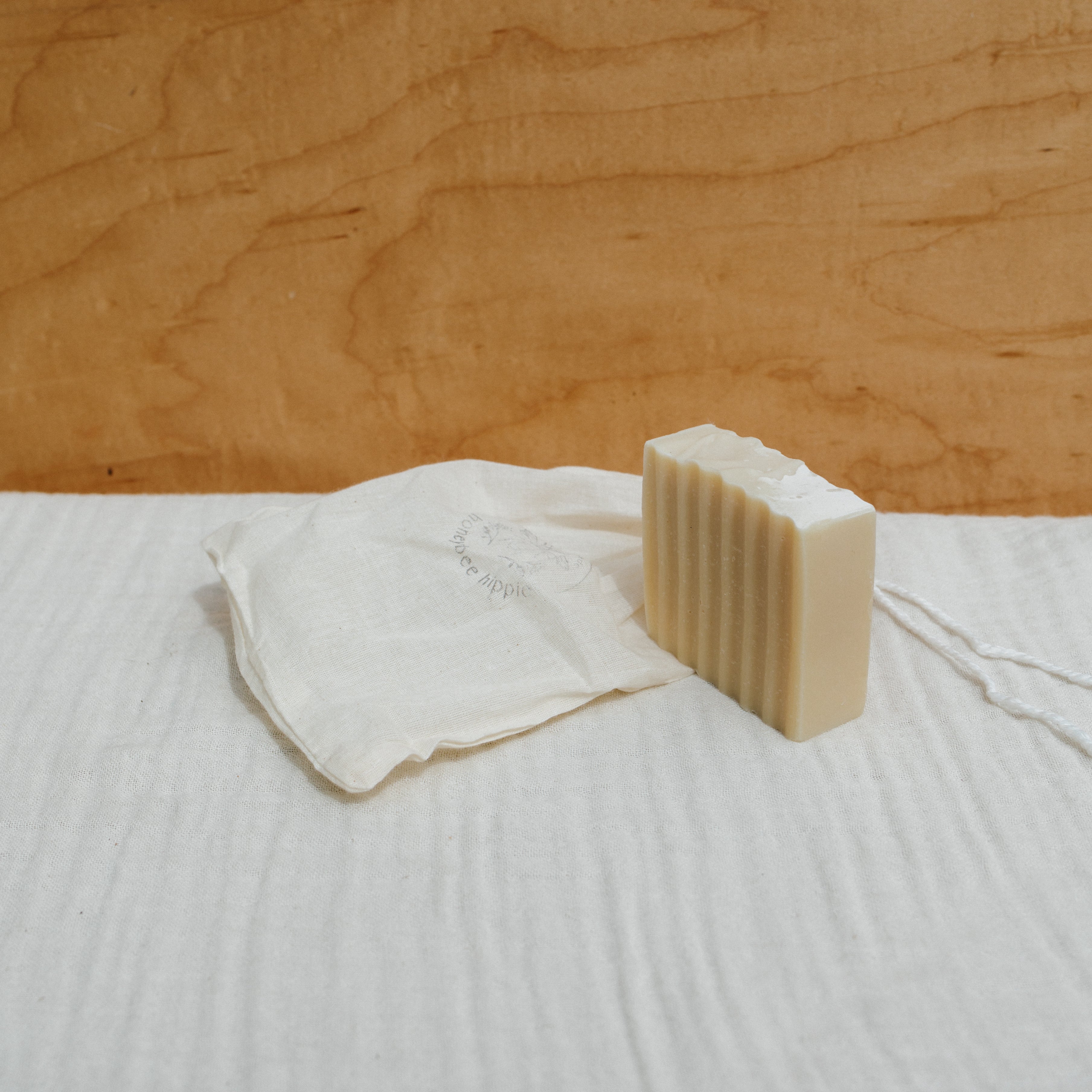 Honeybee Hippie Tallow Soap Bar showing a natural, handcrafted soap with honeybee branding and rustic packaging.