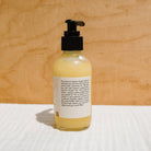 Honeybee Hippie California Sunshine Tallow Body Oil bottle with golden label and natural packaging.