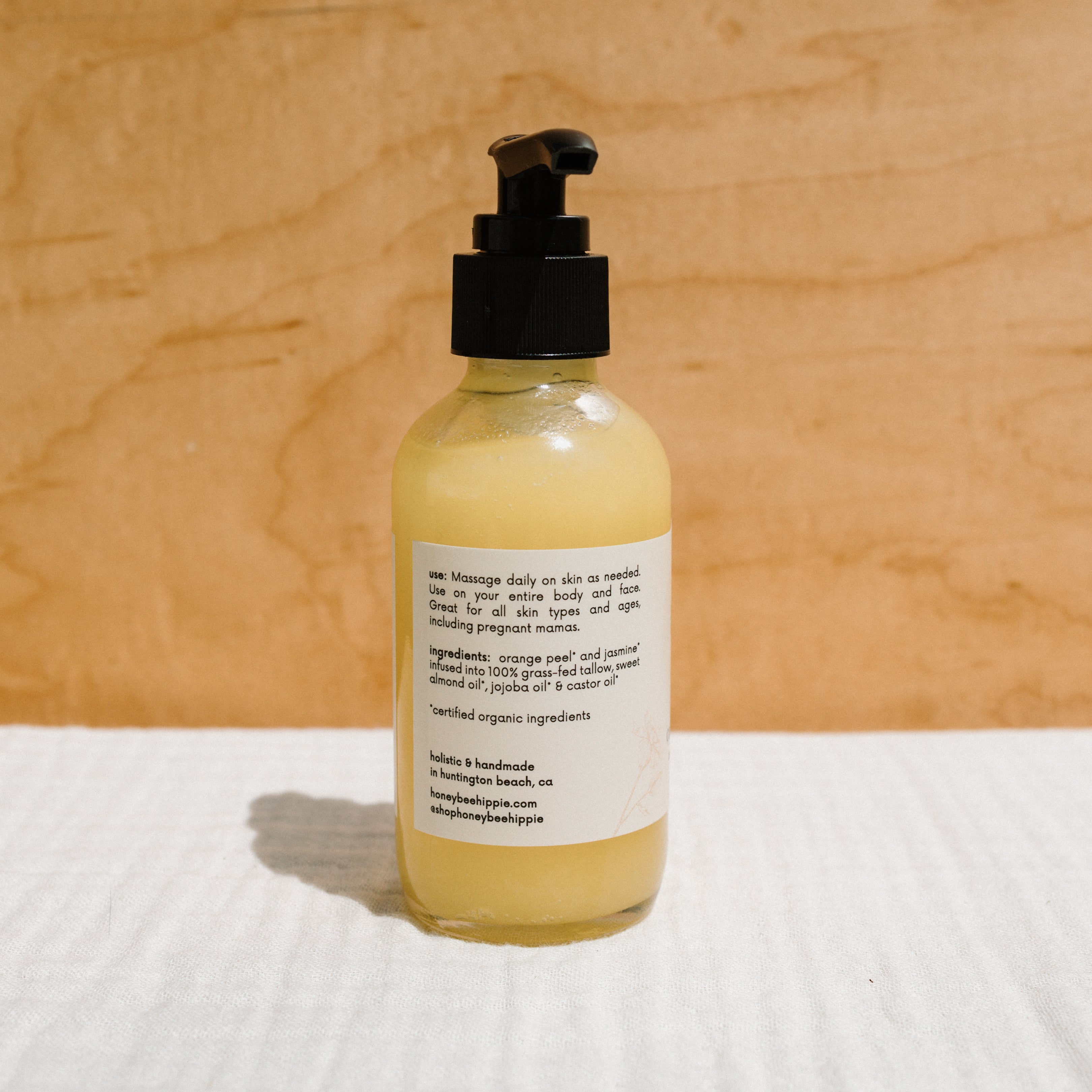 Honeybee Hippie California Sunshine Tallow Body Oil bottle showing the natural, nourishing tallow oil for skin care.