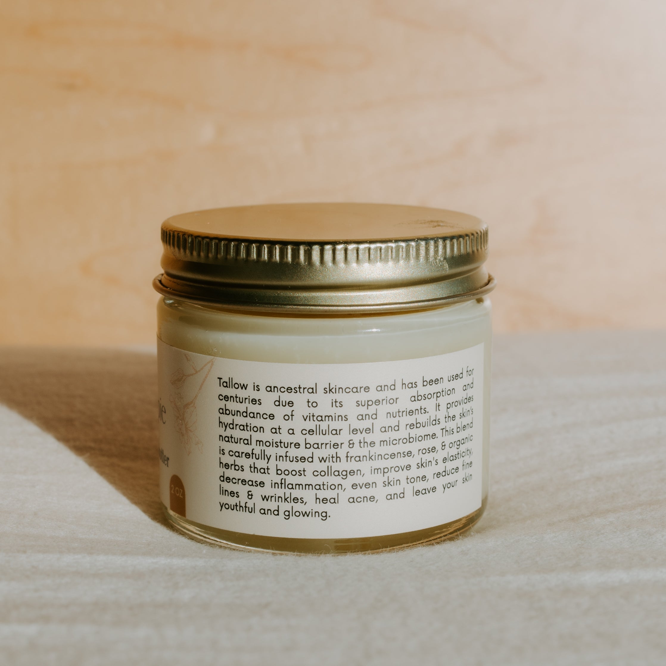 Creamy Honeybee Hippie Honey Hydrate Tallow Butter in a jar, showcasing its rich, smooth texture and natural ingredients.