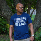 Adult graphic tee by The Graphic Tee featuring humorous "I Keep All My Jokes In A Dad-A-Base" design on a short sleeve shirt.