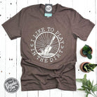 The Graphic Tee I Like to Play in the Dirt crewneck short sleeve graphic tee featuring playful dirt-themed design on white fabric.