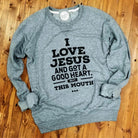 I Love Jesus and Got a Good Heart, but This Mouth crewneck sweatshirt by The Graphic Tee, featuring a bold graphic design.