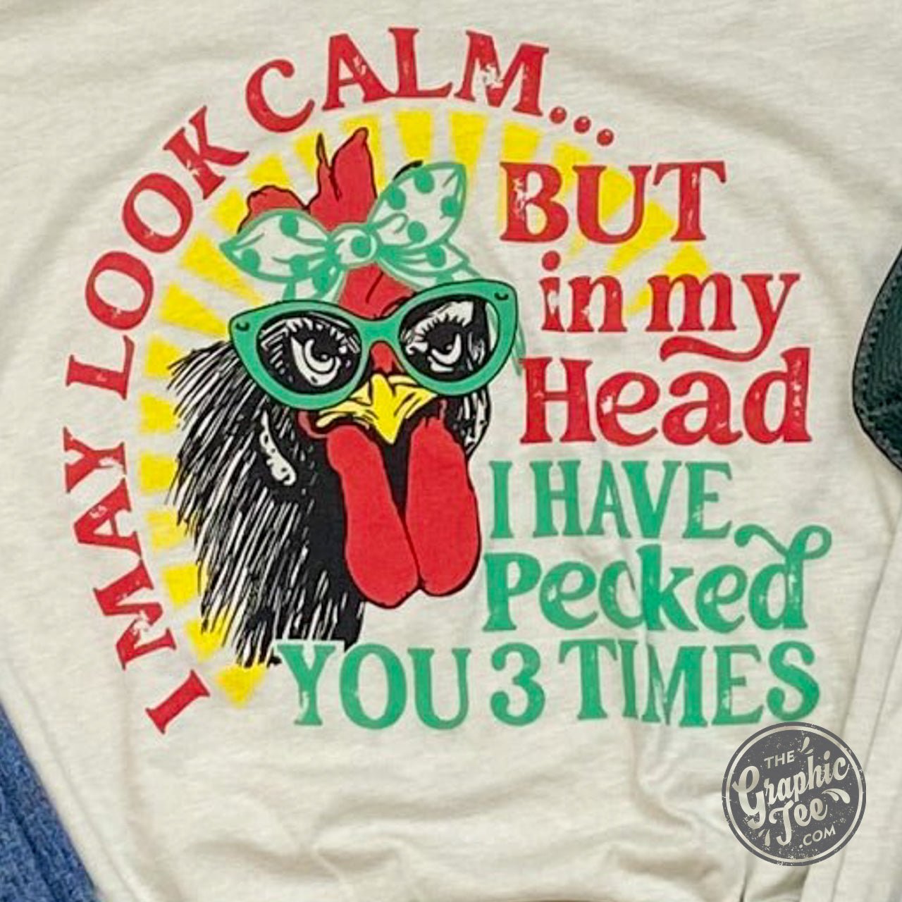 Black V-neck graphic T-shirt from The Graphic Tee featuring the phrase "I May Look Calm but..." printed on the front.