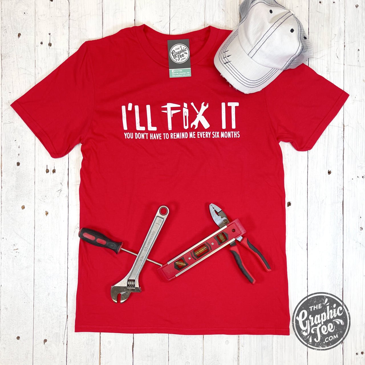 The Graphic Tee I'll Fix It short sleeve graphic t-shirt with a humorous design on a white background.