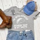 Gray short sleeve graphic tee from The Graphic Tee featuring a fun "I'm Into Fitness Taco" design on the front.