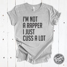 Grey unisex SS graphic T-shirt with humorous "I'm Not A Rapper I Just Cuss A Lot" print from The Graphic Tee brand.