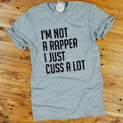 Grey unisex graphic tee from The Graphic Tee featuring the bold text "I'm Not A Rapper, I Just Cuss A Lot" on the front.