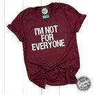 Unisex SS Graphic Tee by The Graphic Tee with bold "I'm Not For Everyone" print on soft fabric.