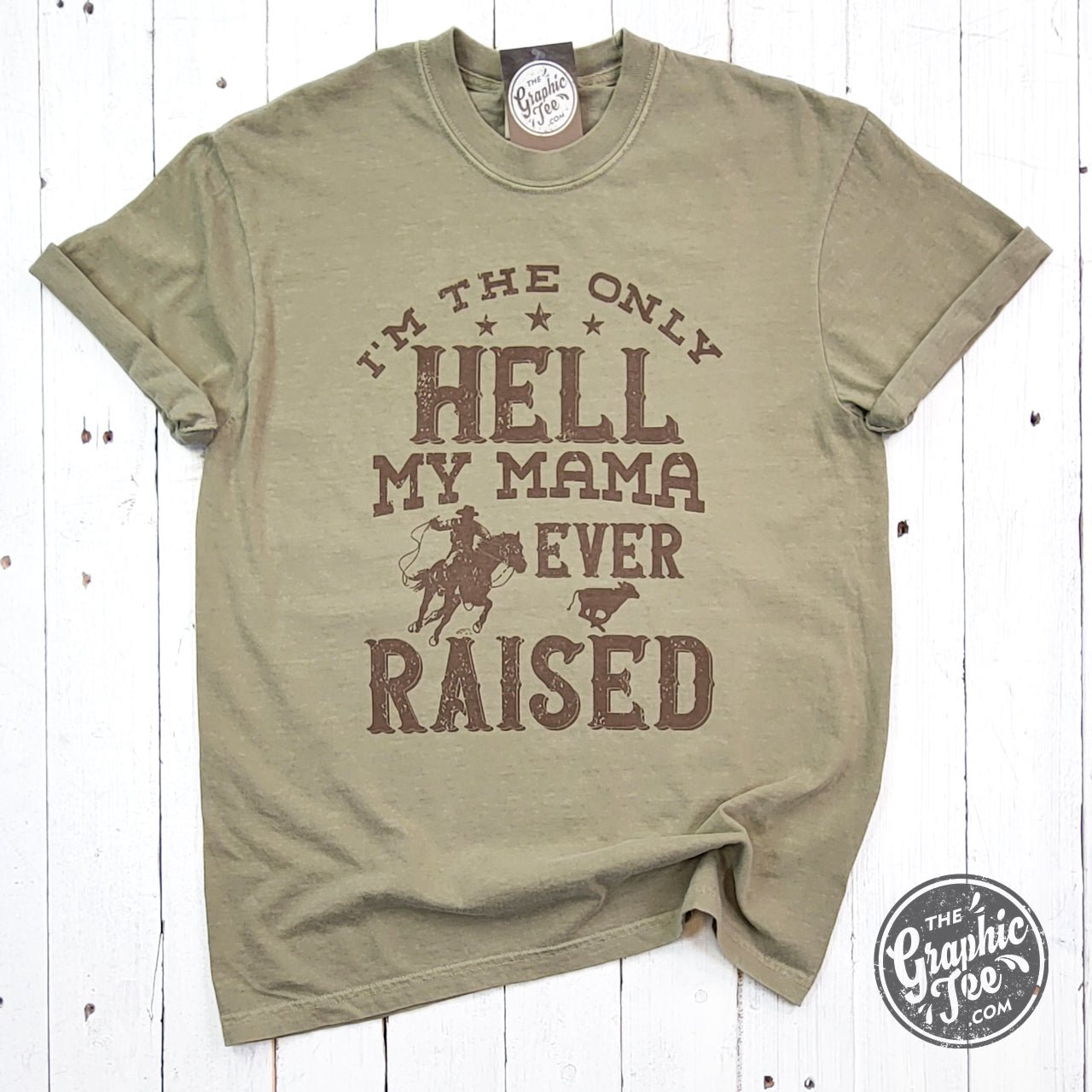Pink pigment dyed graphic tee featuring bold text and design, from The Graphic Tee brand. Casual short-sleeve men's or women's shirt.