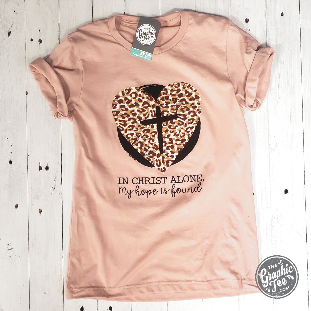 Unisex SS graphic tee featuring the phrase "In Christ Alone, My Hope is Found" by The Graphic Tee, with a simple, inspirational design.