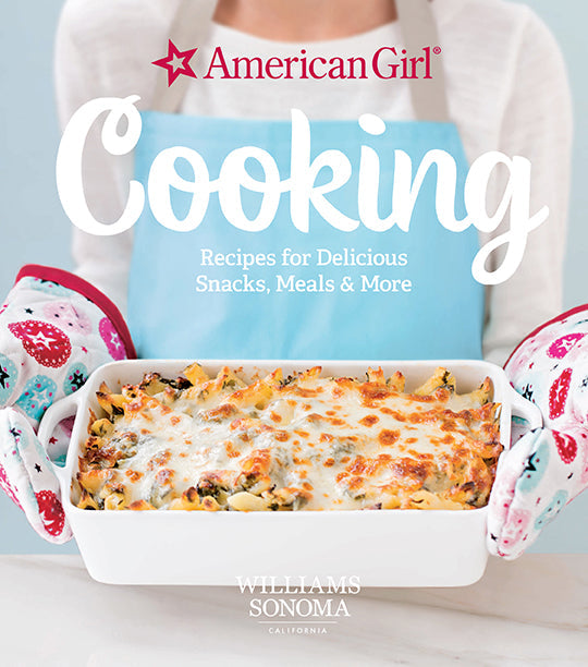 Hardcover American Girl Cooking book by Insight Editions with colorful illustrated cover featuring American Girl characters